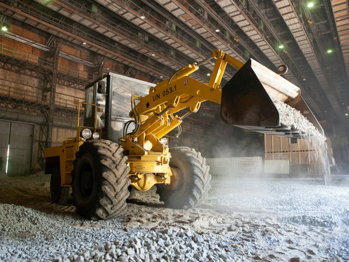 Excavator at work. Heavy machinery on construction site.