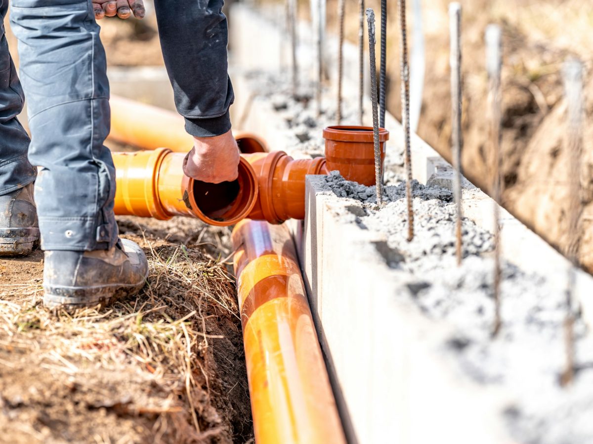 installation of a sewage plastic pipe during the construction of a house