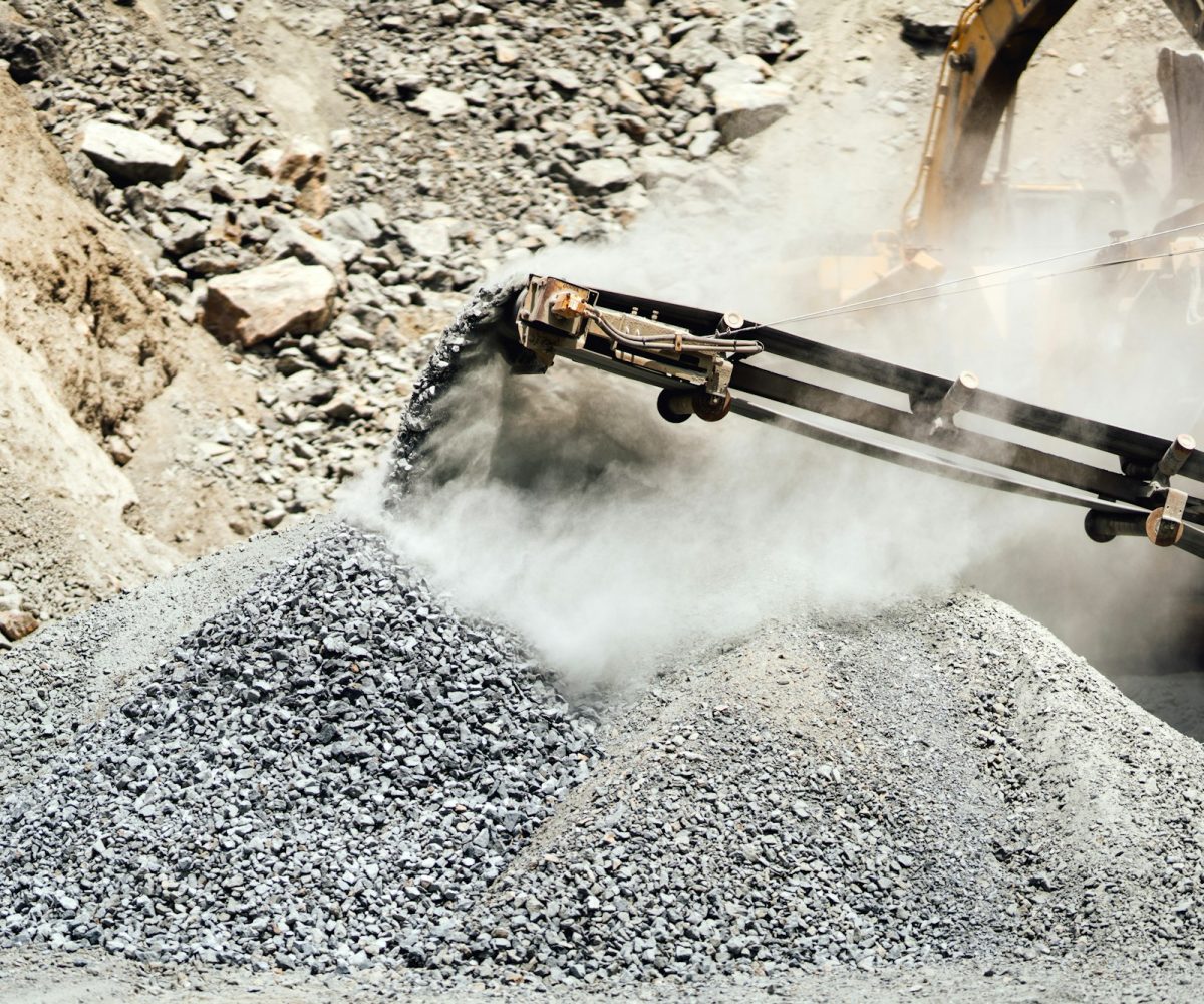 Stone breaker at industrial rock and marble quarry. Granite rocks crusher